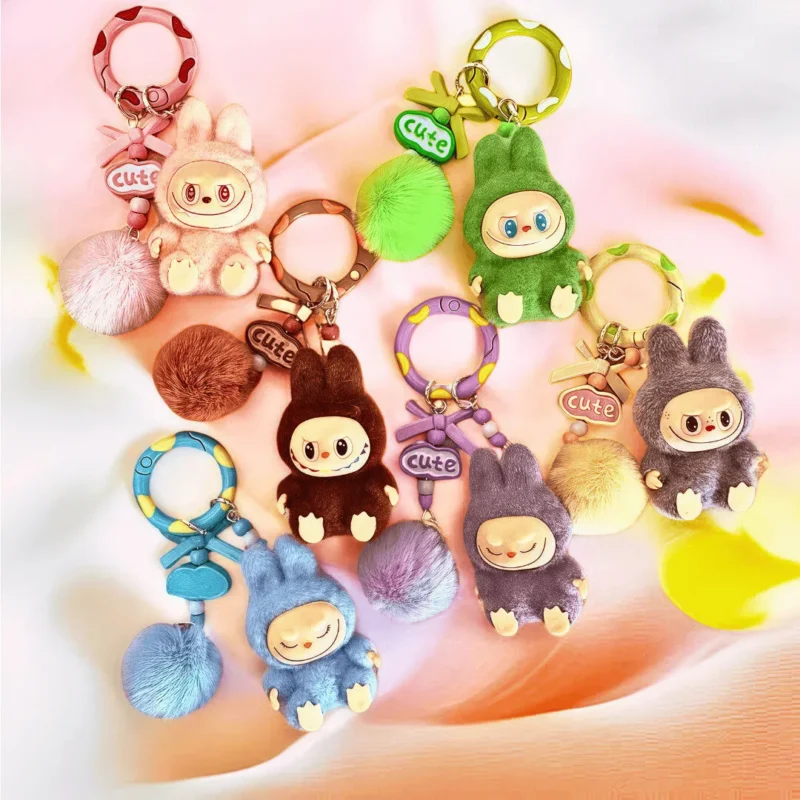 The Mini Labubu-themed keychain blends style and practicality. A perfect gift for Labubu fans, cute character collectors, kawaii lovers, or anyone into unique, adorable accessories. Don’t miss owning this charming companion—it’ll surely bring smiles whenever you see it! ✨Cute & Compact – Carry Anywhere! + FREE SHIPPING ✨Handcrafted with Premium PVC + Flocking – Built to Last!