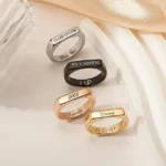 Custom stainless steel rings with personalized engraving. 14k plating options, hypoallergenic, handmade in the US. Perfect gift in a delicate box.
